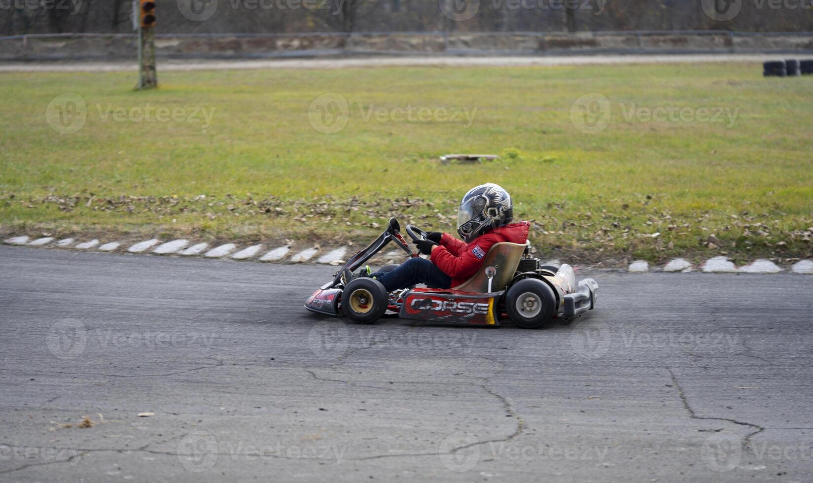 a person riding a go-kart photo