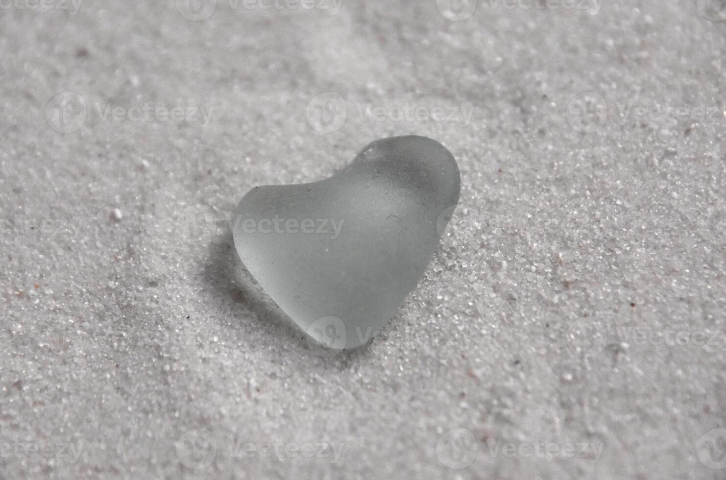 Heart Shaped Surf Tumbled Sea Glass on Sand photo