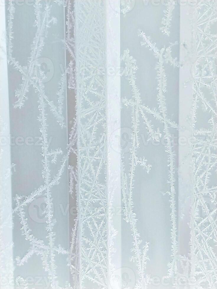 winter vertical fairytale frosty background with snow patterns and frost on white texture photo