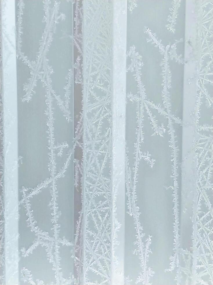 winter vertical frosty background with snow patterns on ribbed texture photo
