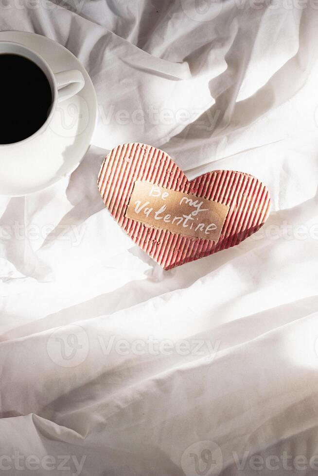 Cozy Valentine's Day background. Festive morning in bed. photo