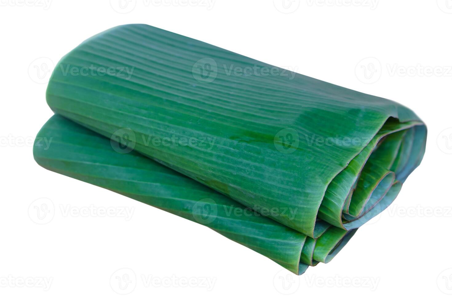 Folded green banana leaves isolated on white background. Concept, package container from nature, safe for wrapping food. Eco friendly and safety for consumers. photo