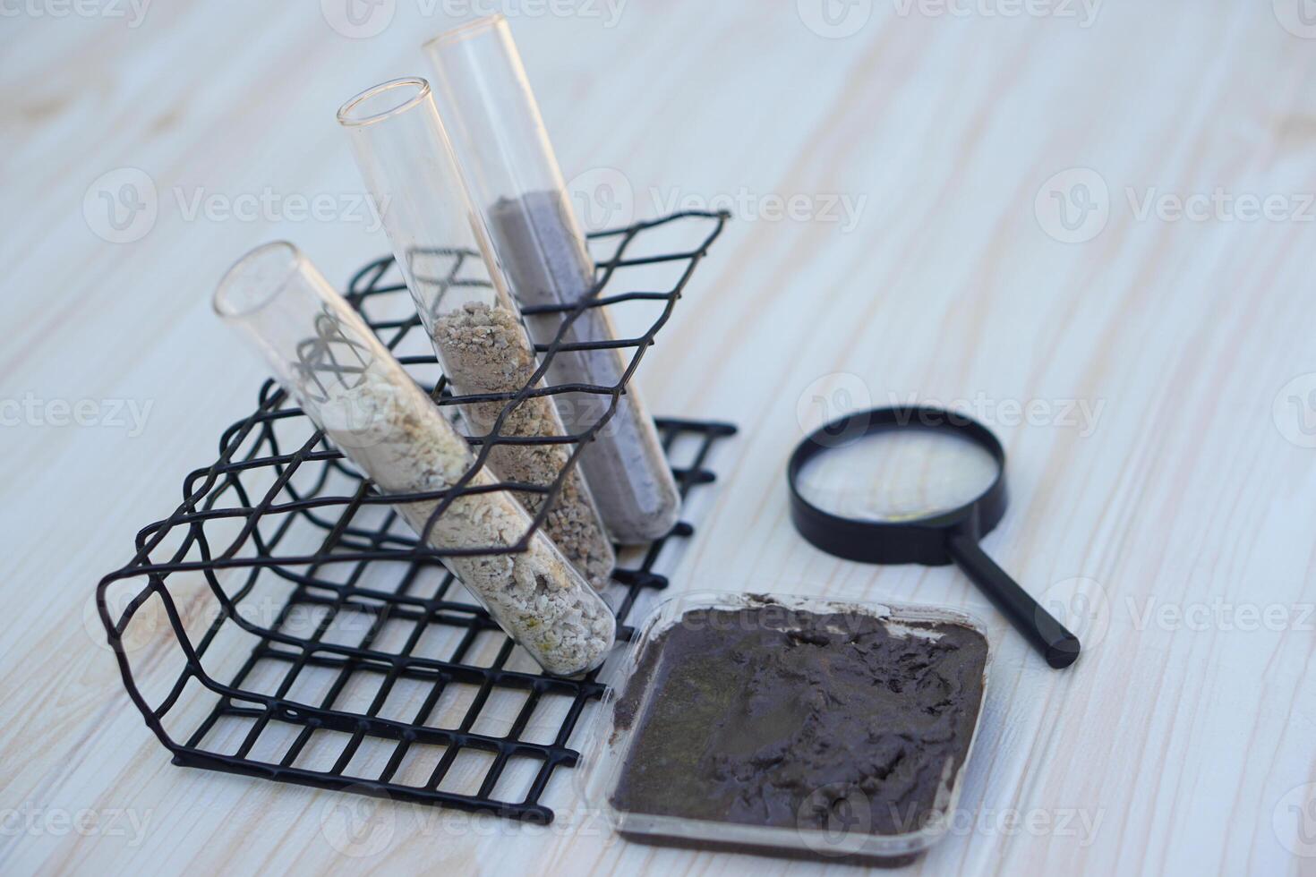 Test tubes that contain sample soil. Concept, soil quality inspection, research and science experiment. Laboratory. Find the best from different soil type and source for growing agriculture crops photo