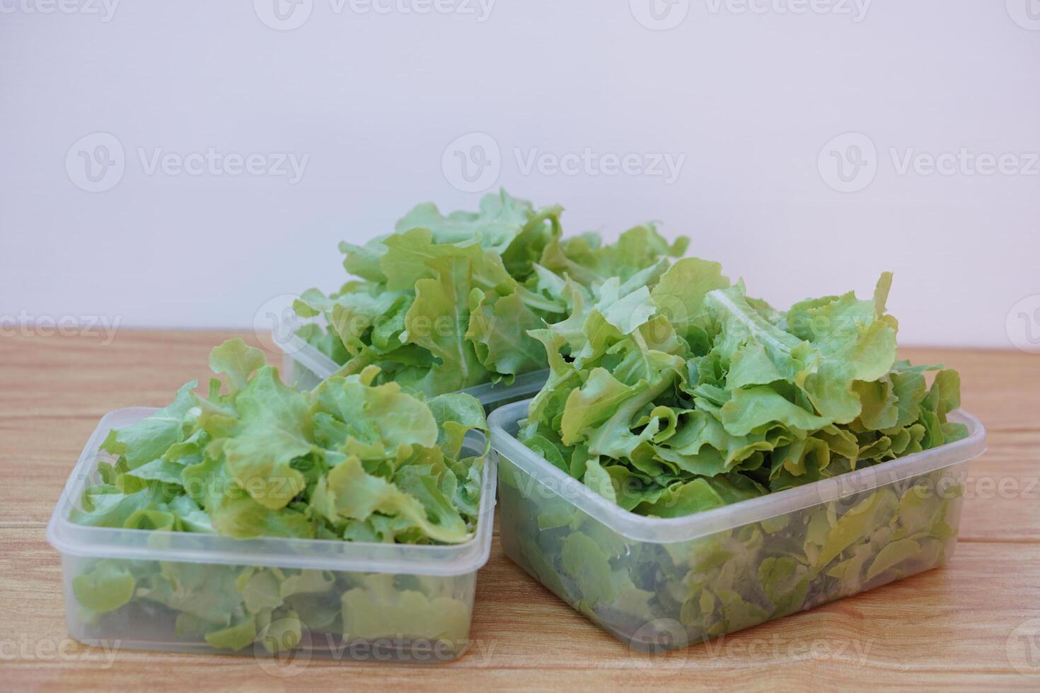 Fresh green organic salad vegetables in transparent food boxes, prepared for cooking or keep fresh in the fridge. Concept, Healthy eating. Washed and ready to eat. photo