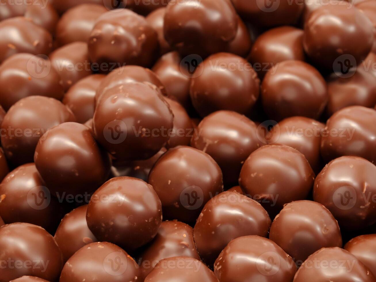 close up chocolate candies on background photo
