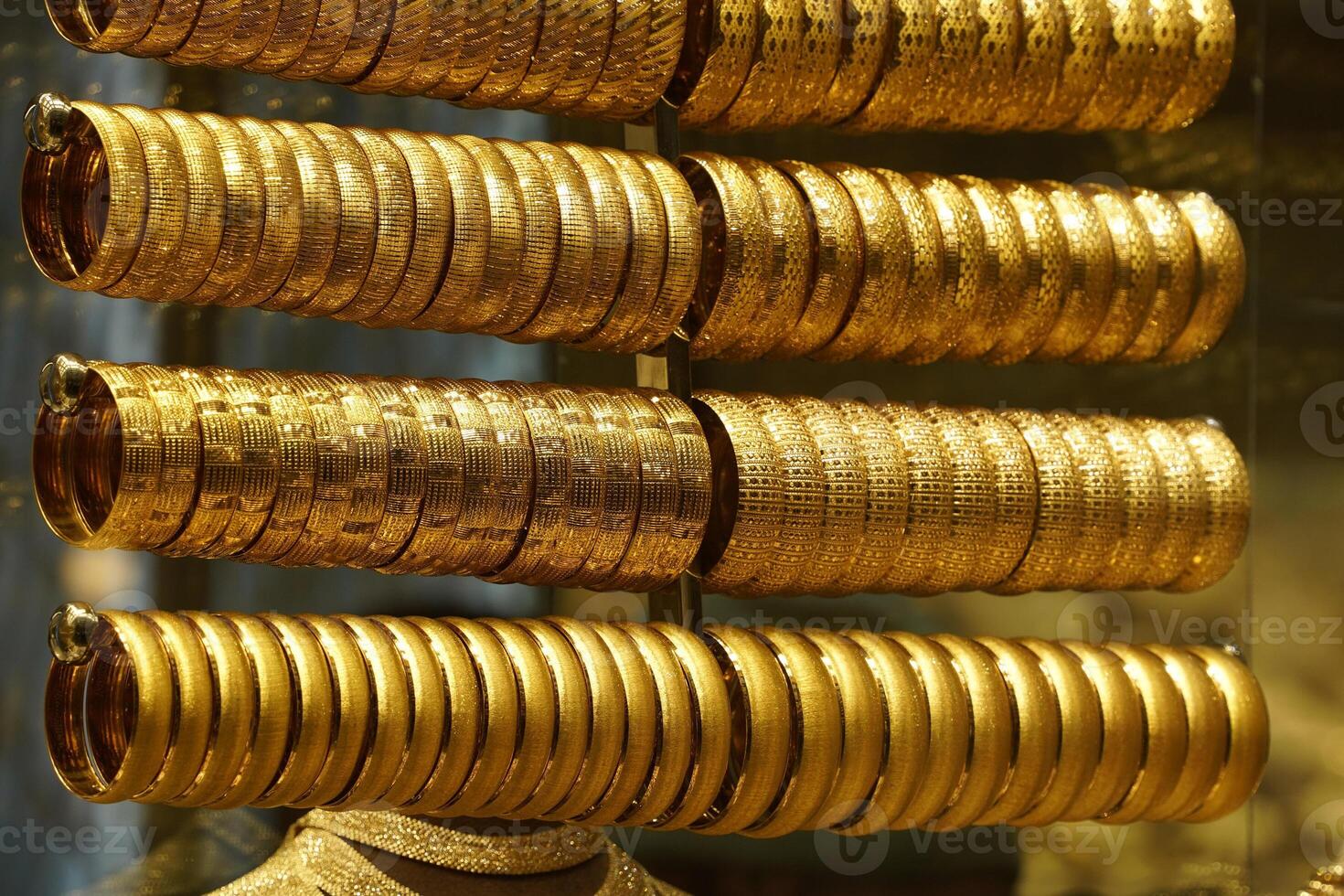 gold shop windows at istanbul grand bazar or Kapali Carsi, Turkey. Jewelry in the store window. A lot of luxury jewelry in the oriental market. Concept of shopping in Middle East. photo