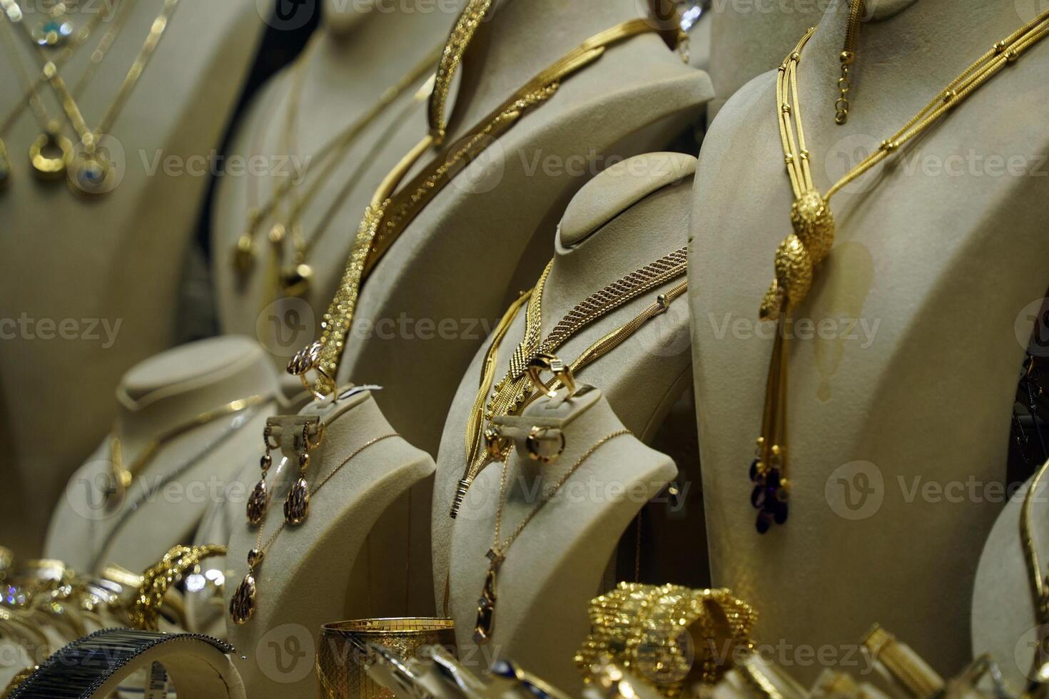 gold shop windows at istanbul grand bazar or Kapali Carsi, Turkey. Jewelry in the store window. A lot of luxury jewelry in the oriental market. Concept of shopping in Middle East. photo