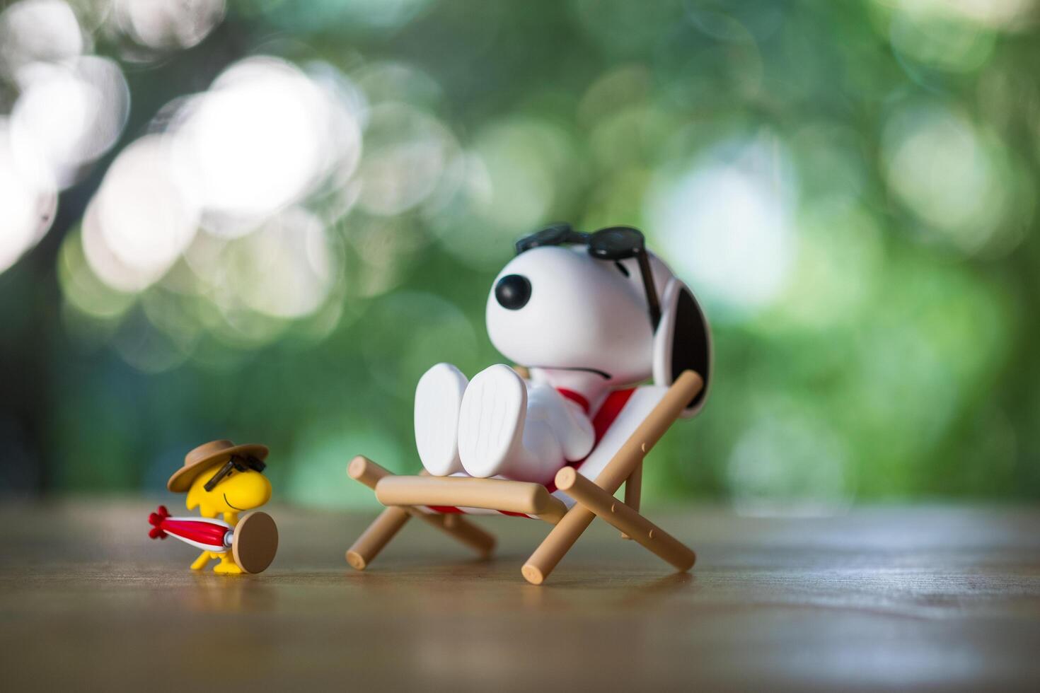 BANGKOK, THAILAND - FEBRUARY 5, 2024 Snoopy Sunbathing. Snoopy the Best Friends series figures. photo