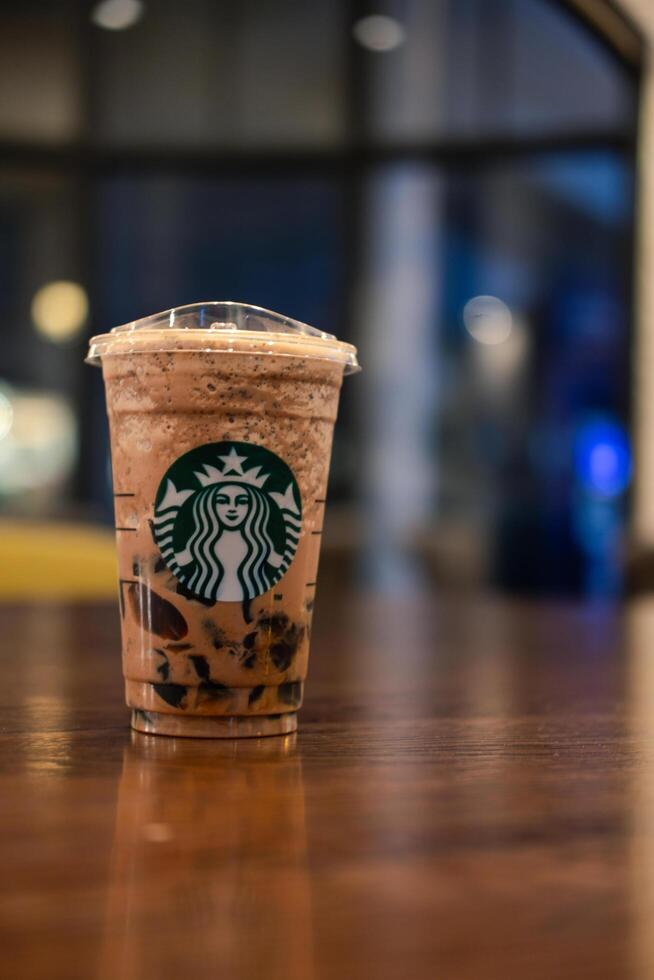 Bangkok, Thailand - February 5, 2024 Starbuck Mocha frappuccino on wood table photo