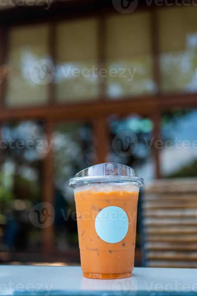 Delicious Thai iced tea with an empty white logo blank space. photo