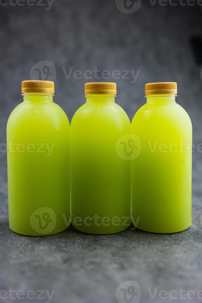 Three tasty healthy guava juice bottles with no brand for commercial advertisement text. photo