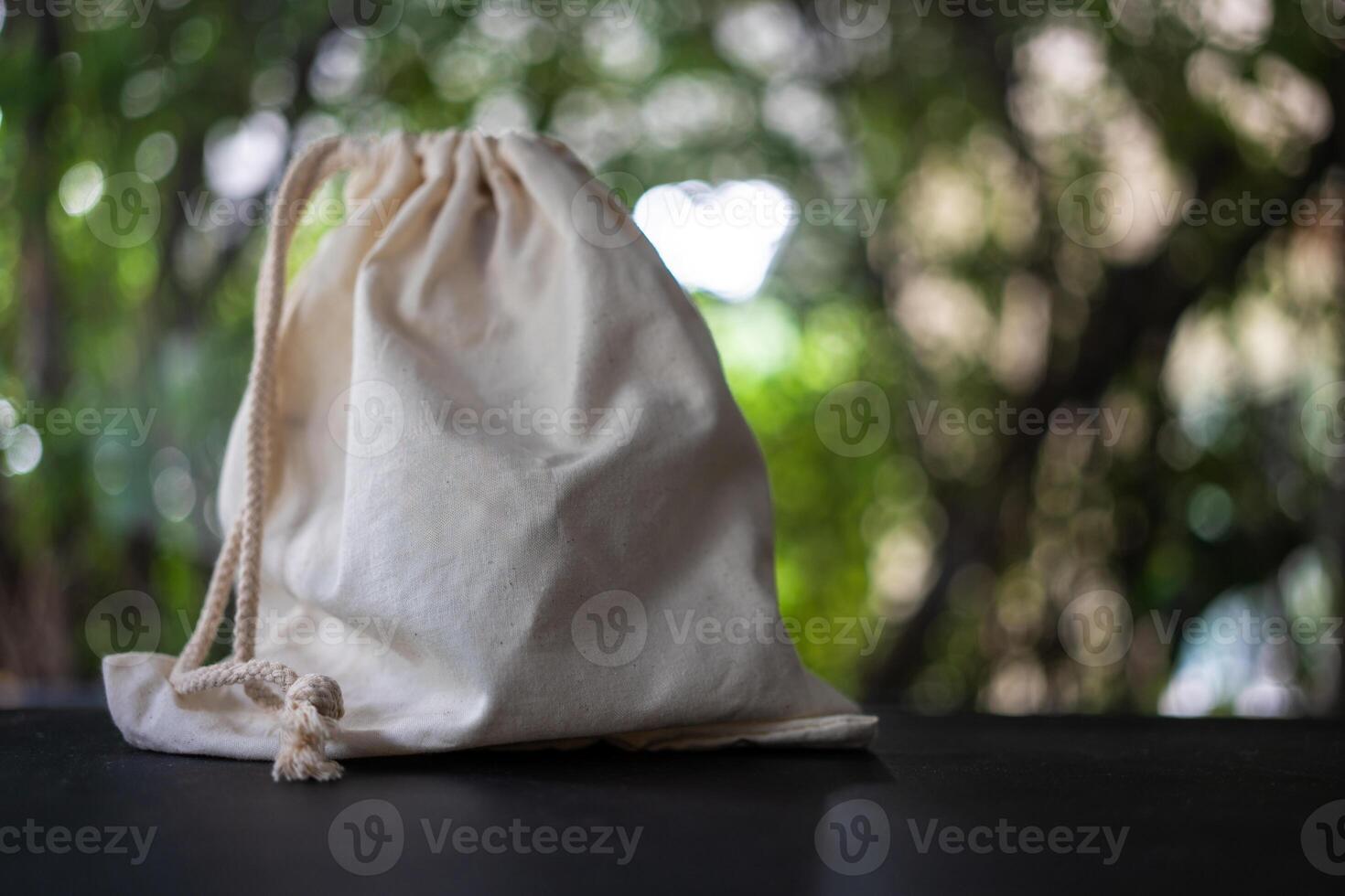 Front view of single drawstring pouch made of canvas fabric small bag photo