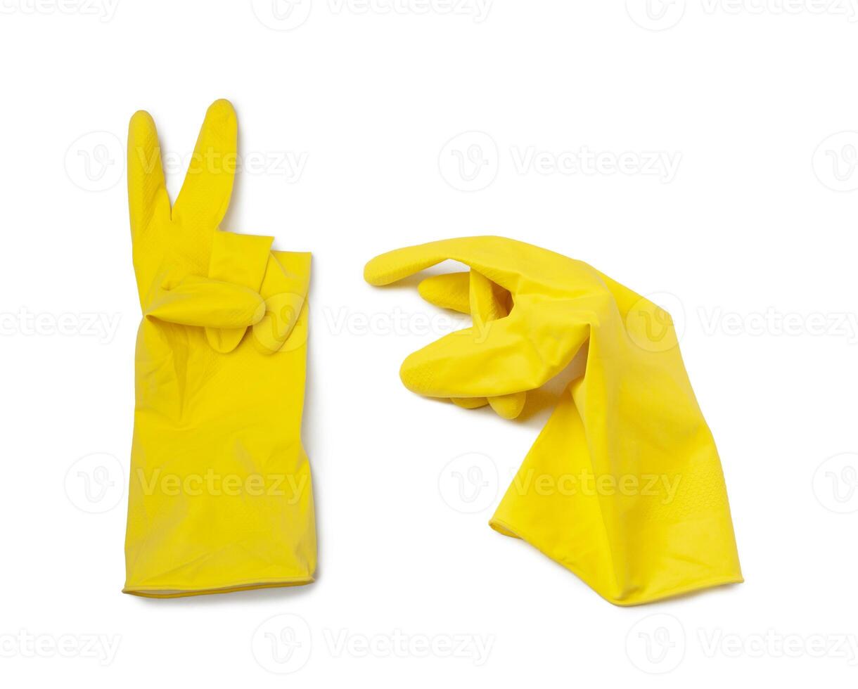 Yellow rubber glove for cleaning isolated on a white photo