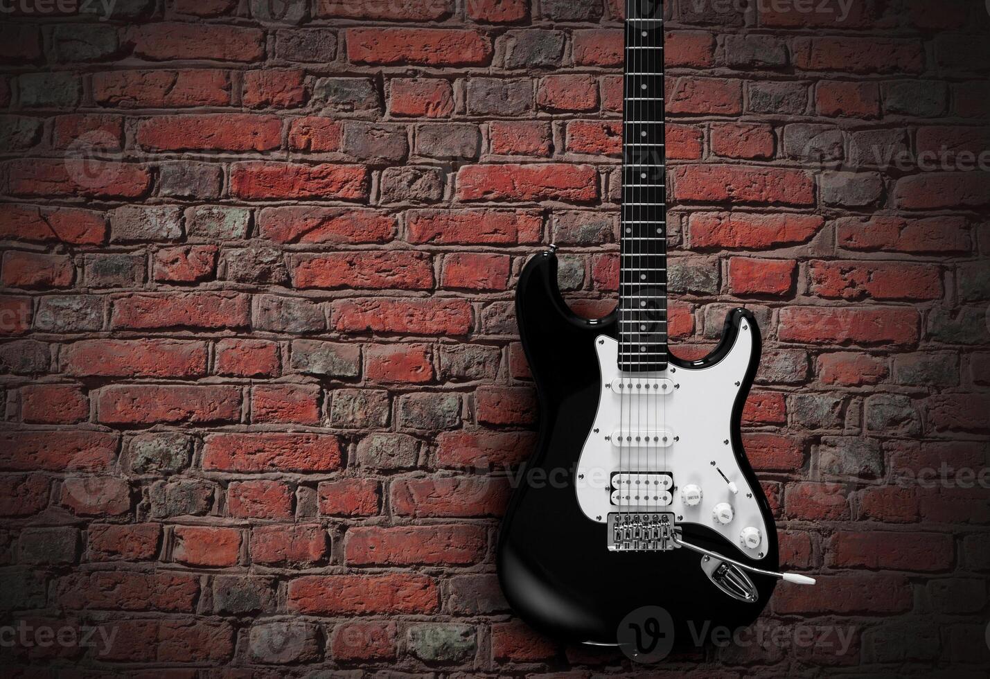 Electric guitar on red brick wall background photo