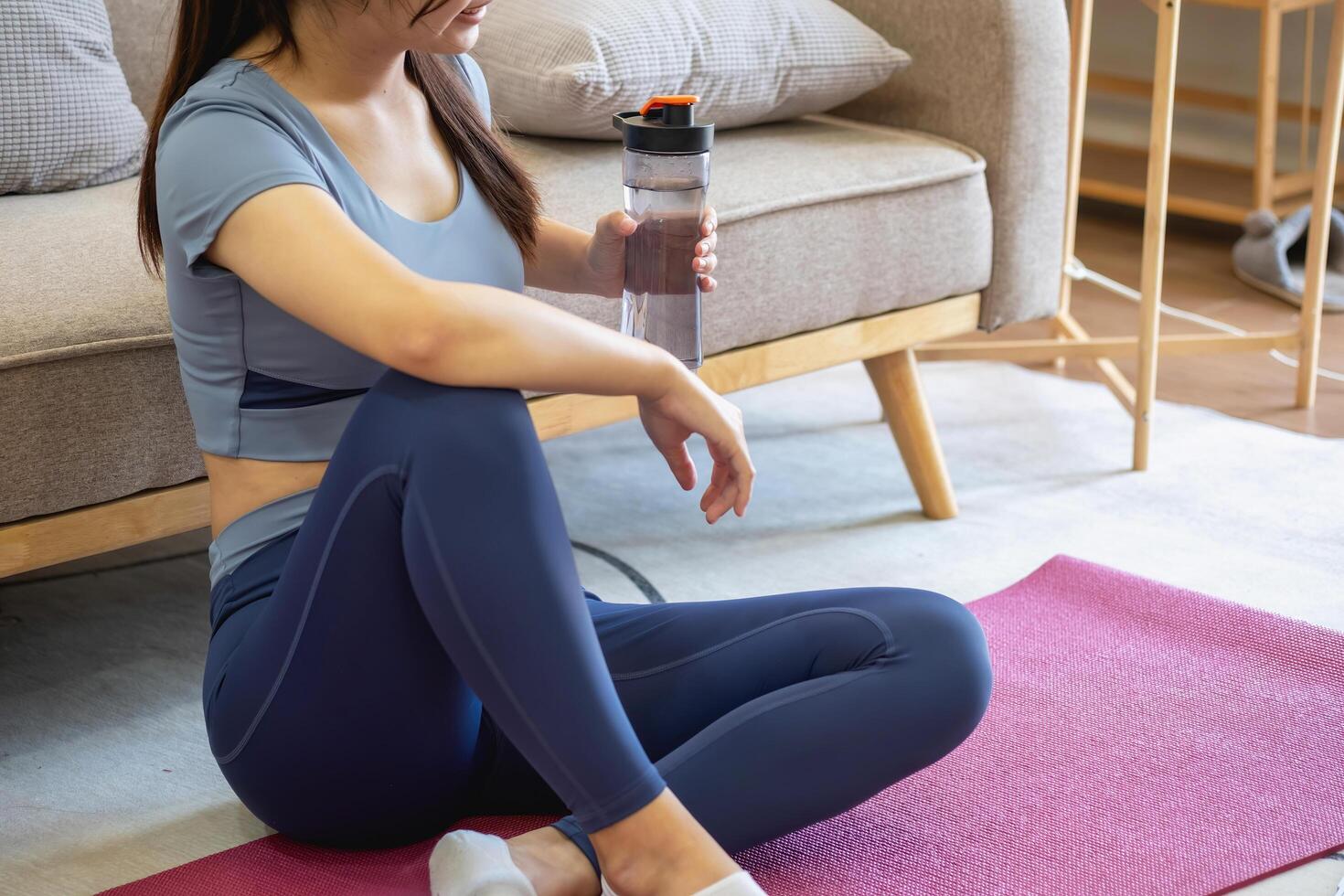 Women are stretching, at home, and fitness Women exercise or do yoga in their bedroom for health and wellness a healthy, calm female person training or working on the house floor. photo