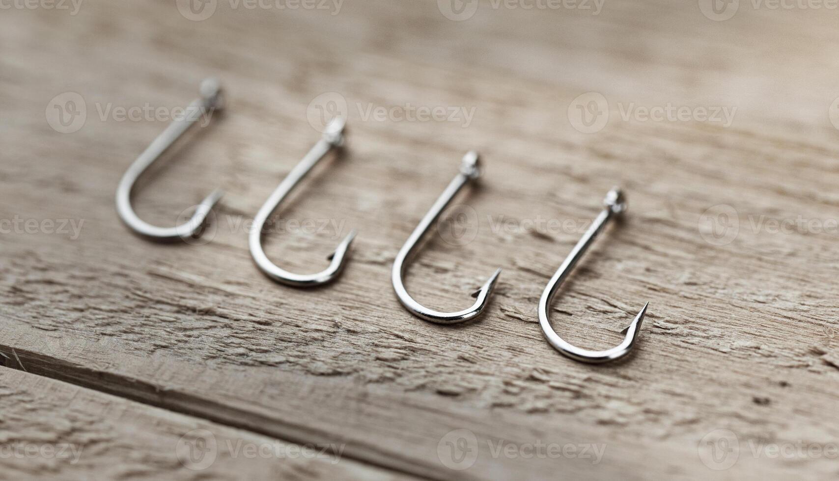 Fishing hooks on a wooden board. Close-up of a fishing hook photo