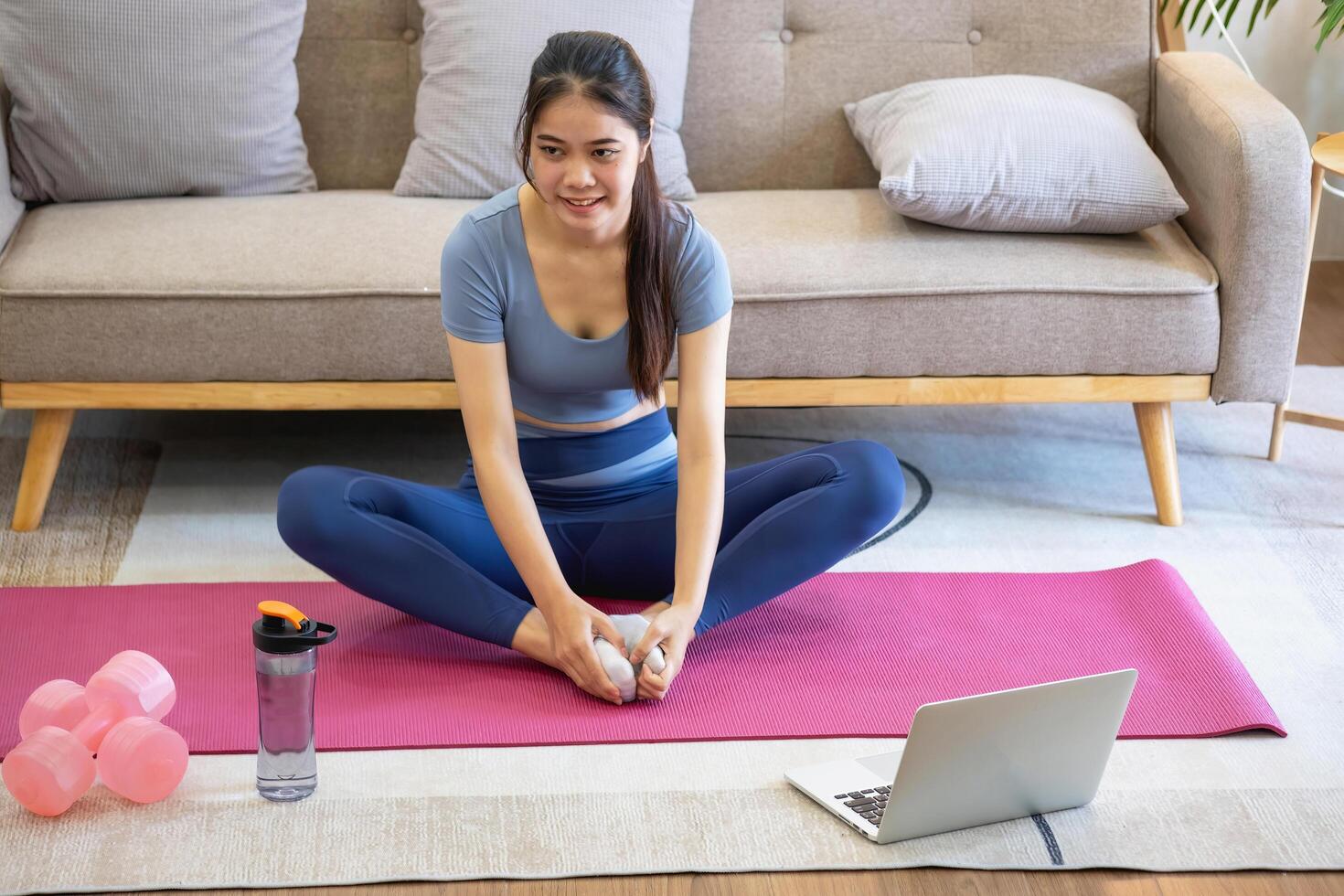 Women are stretching, at home, and fitness Women exercise or do yoga in their bedroom for health and wellness a healthy, calm female person training or working on the house floor. photo