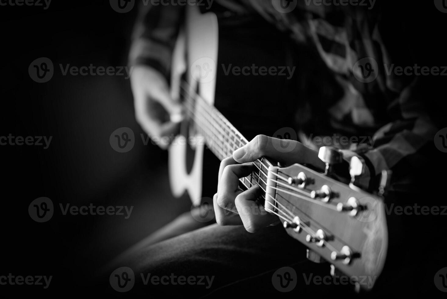 men playing acoustic guitar photo