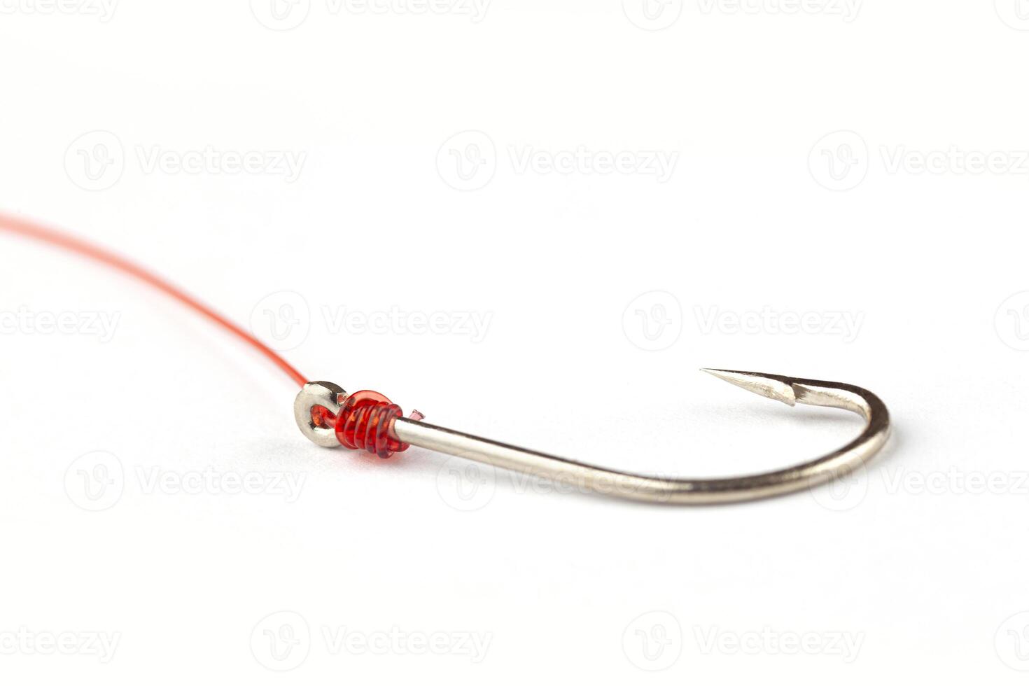 fishing hook with fishing line on white background. Blurred concept photo