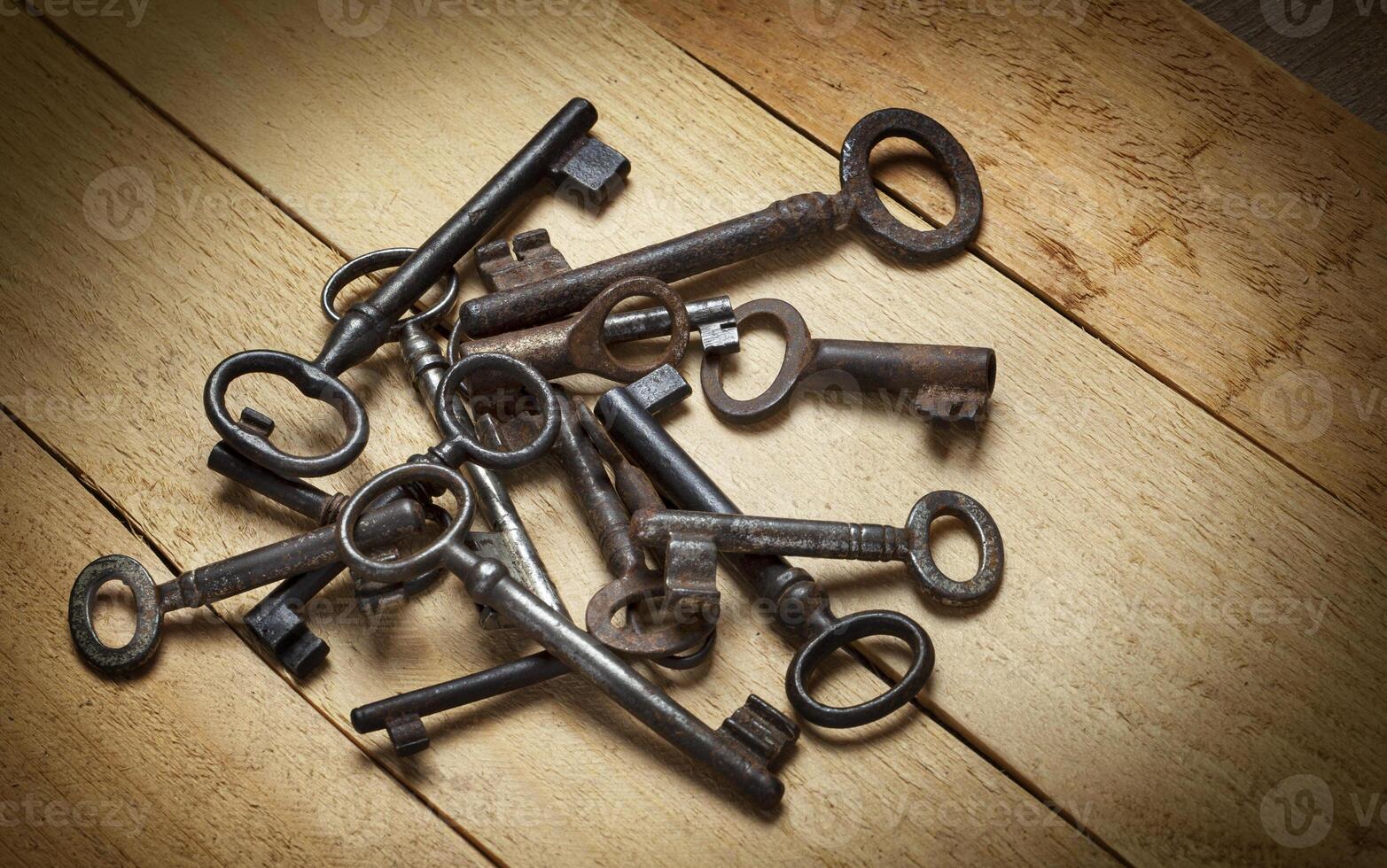 old keys on a background of wooden boards photo