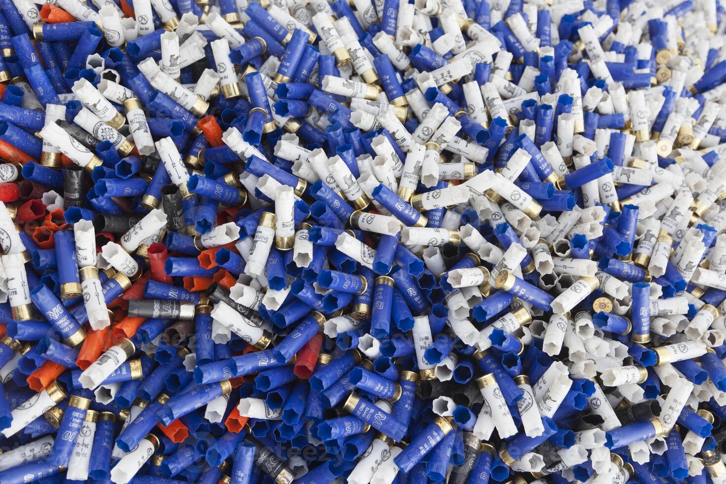 Background of many colorful shot empty shotgun shells photo
