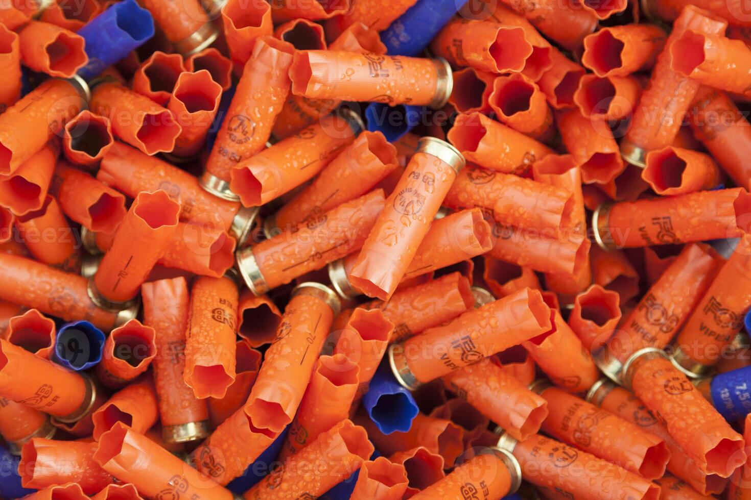 Background of many colorful shot empty shotgun shells photo