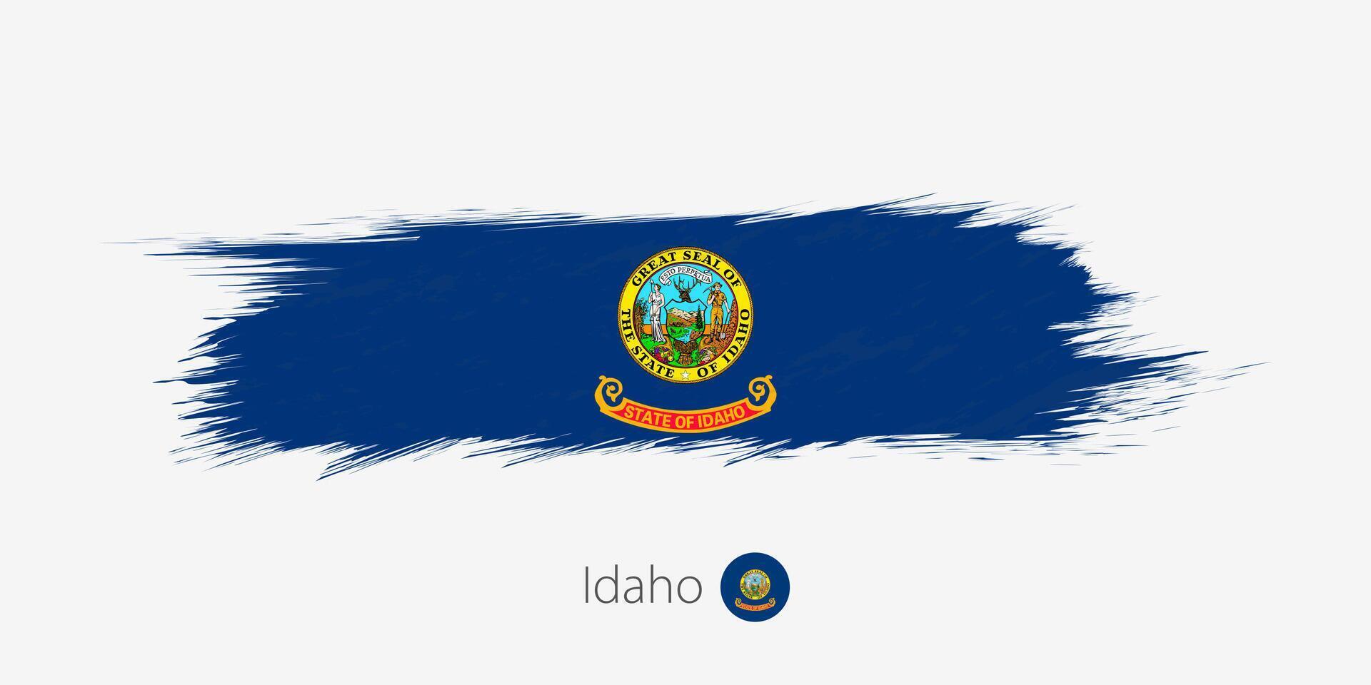 bandera de Idaho nosotros estado, grunge resumen cepillo carrera en gris antecedentes. vector