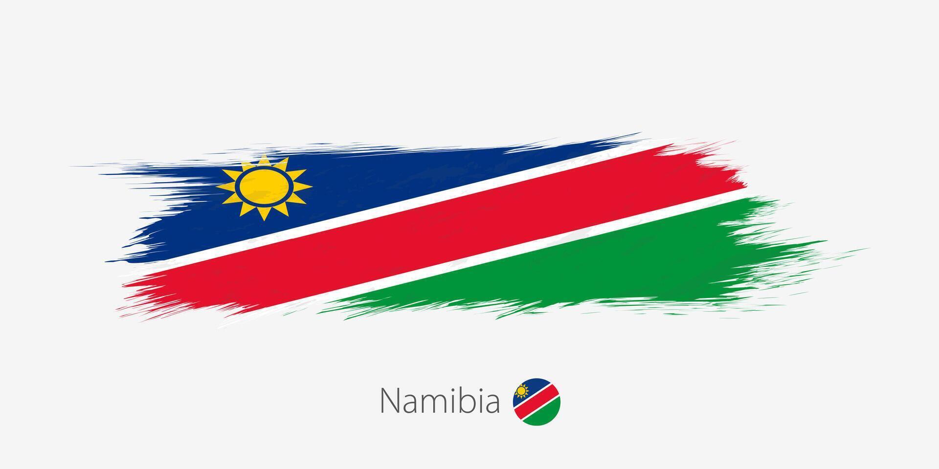 Flag of Namibia, grunge abstract brush stroke on gray background. vector