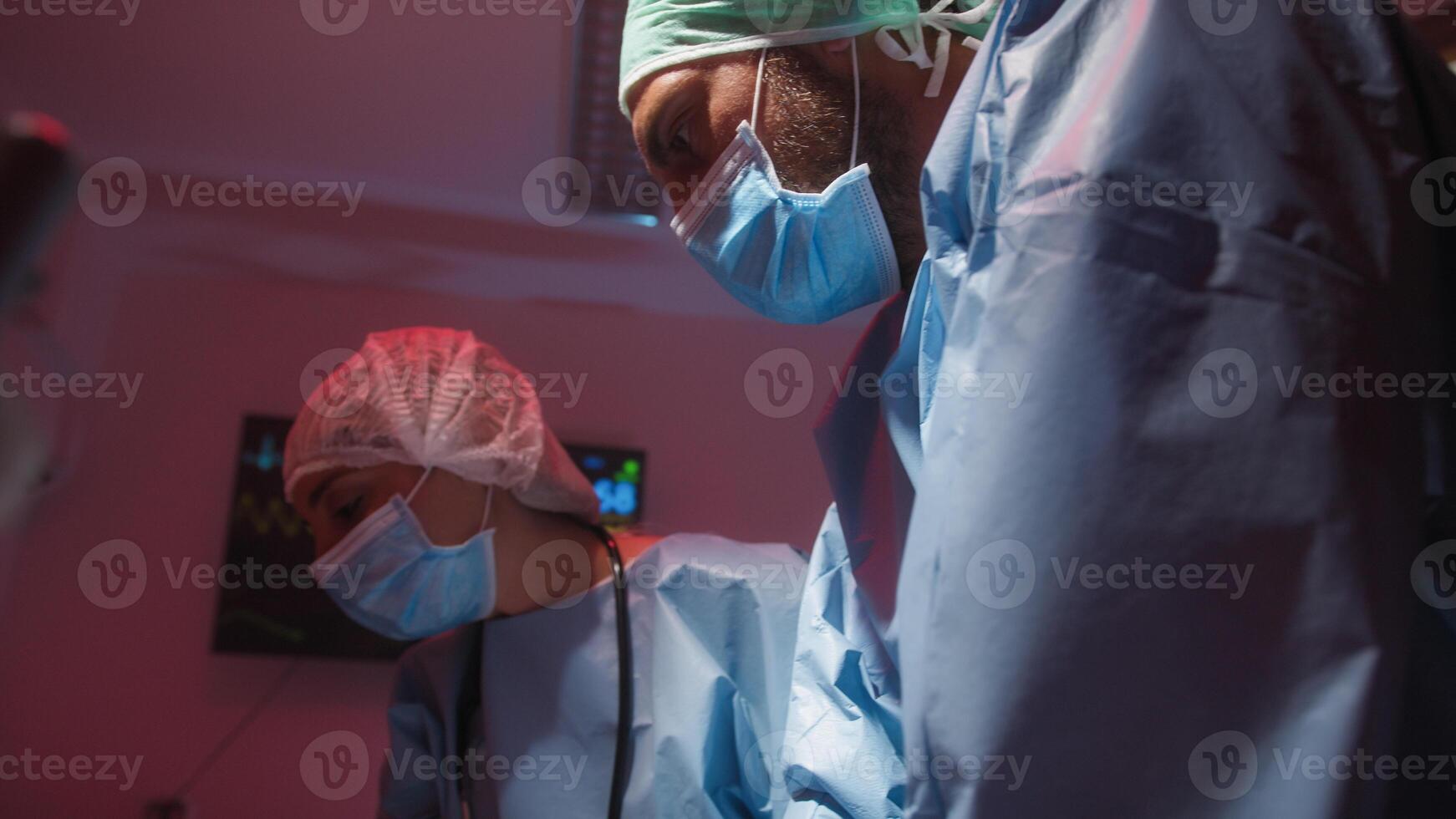 Medical staff try to revive the patient with cardiac massage photo