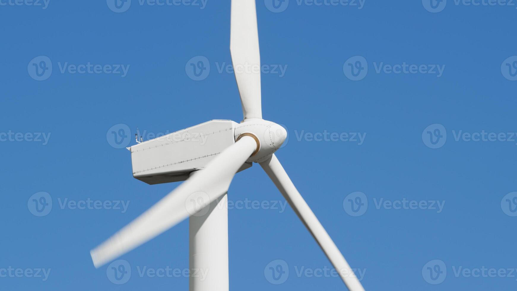 Detail of a wind turbine while it is rotating photo