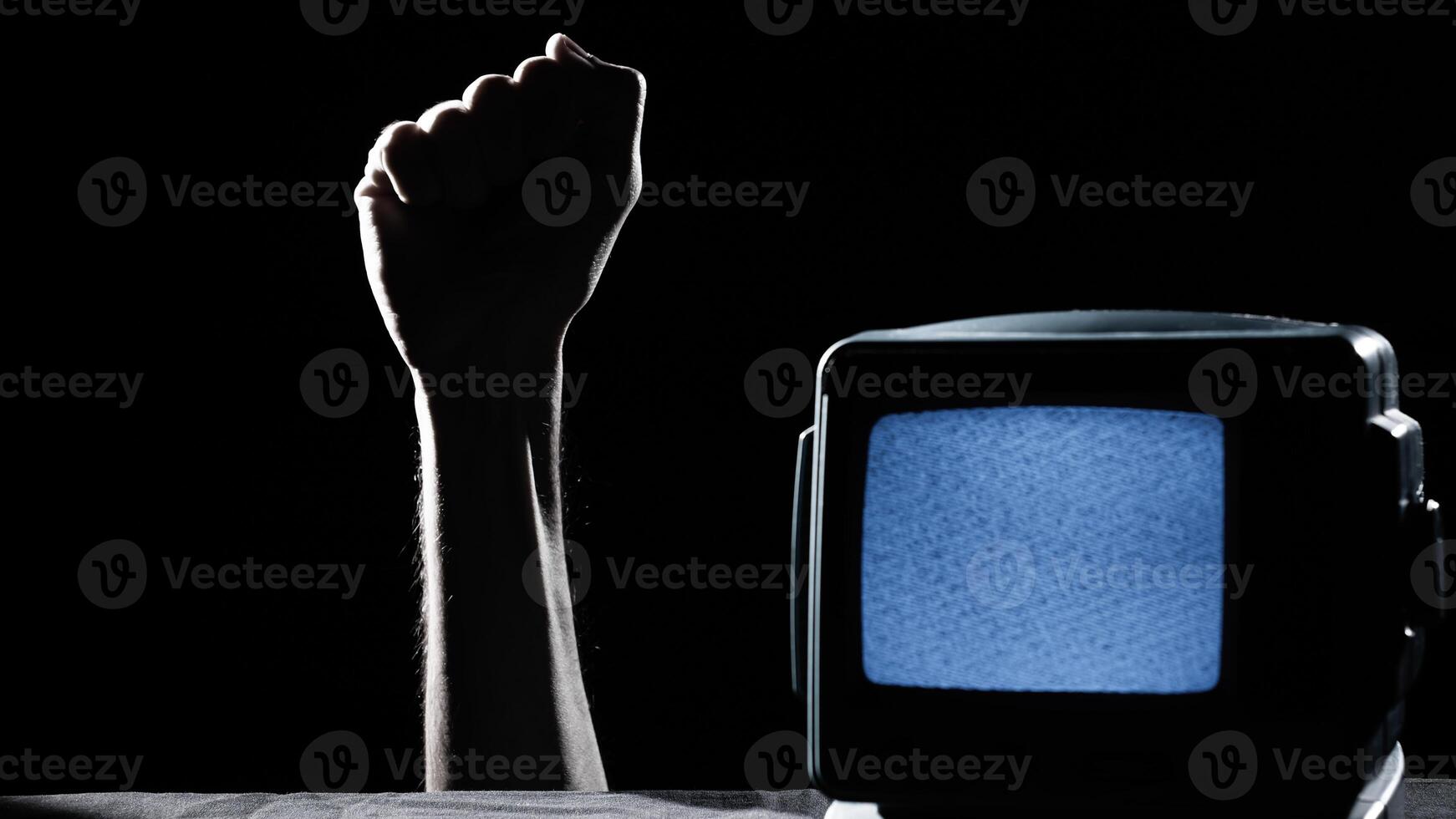 Closed Fist Of a Man And Static Tv For Black History Month photo