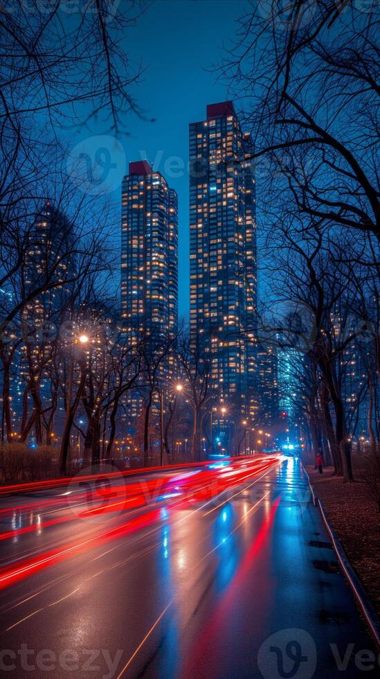 AI generated Twilight cityscape with glowing high-rises and traffic light trails photo