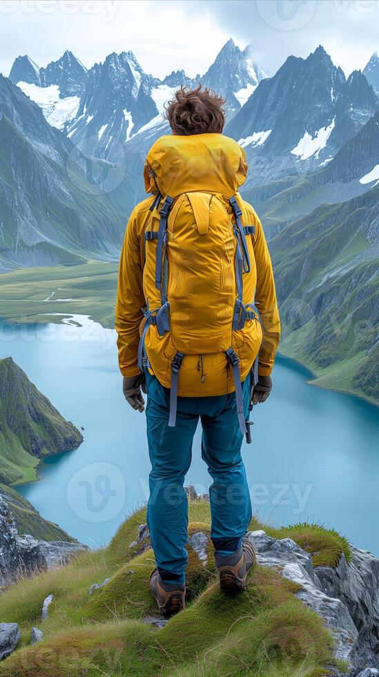 AI generated Man Standing on Mountain Summit With Backpack photo