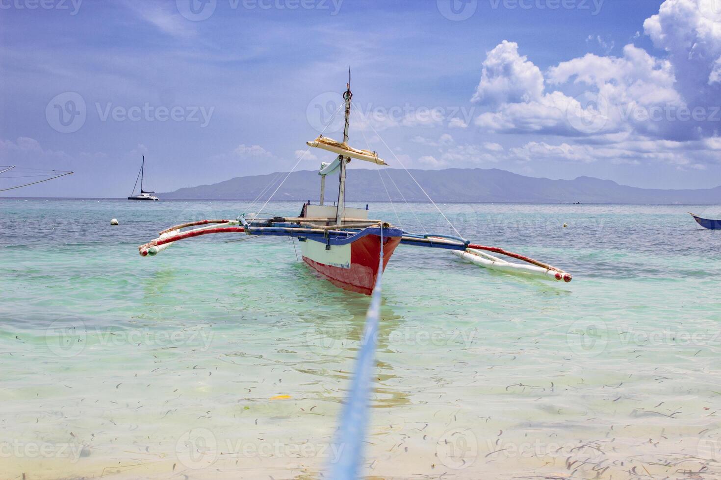 Boat stranded on a paradise beach photo