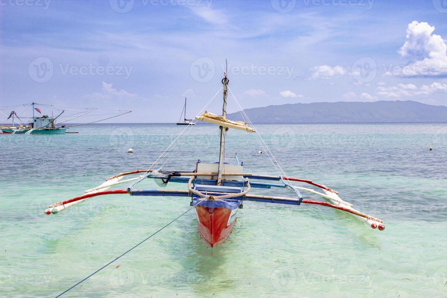 Boat stranded on a paradise beach photo