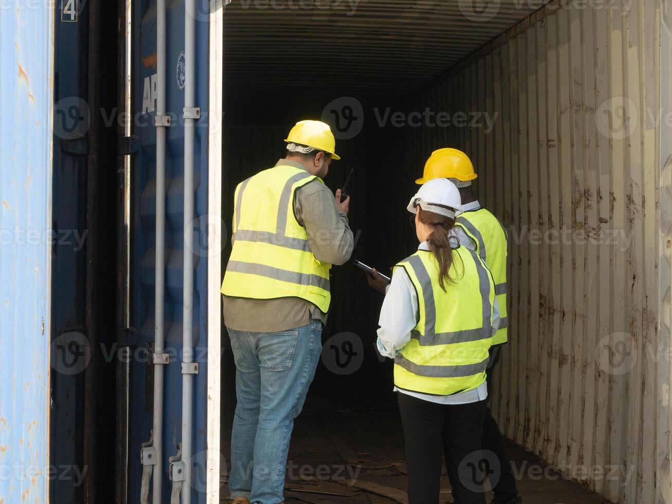 backside person people human yellow white hardhat helmet safety walking discovery container auction industry technology shipping warehouse transportation storage store cargo factory technology dock photo
