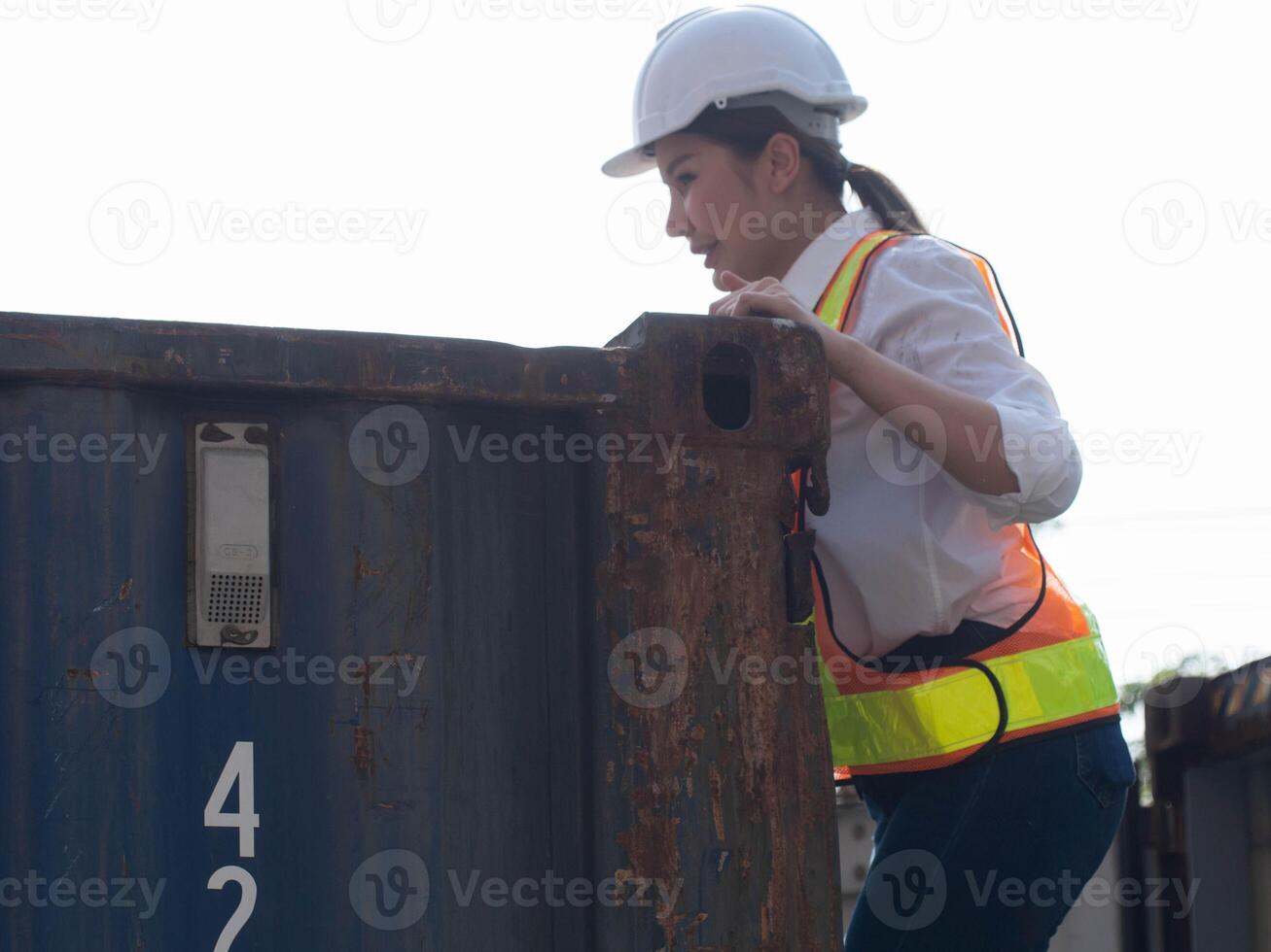 white hardhat helmet safety manager director supervisor person people woman check up check list order container cargo logistic shipping warehouse industry technology transportation factory storage photo