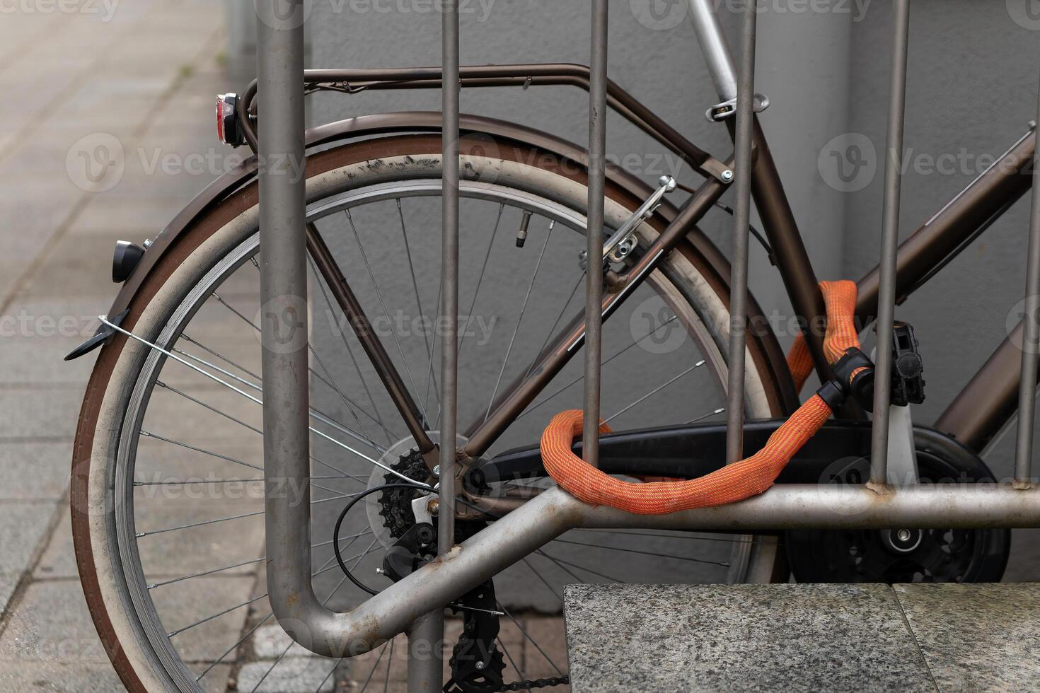 bicycle in a city on a iron railing photo