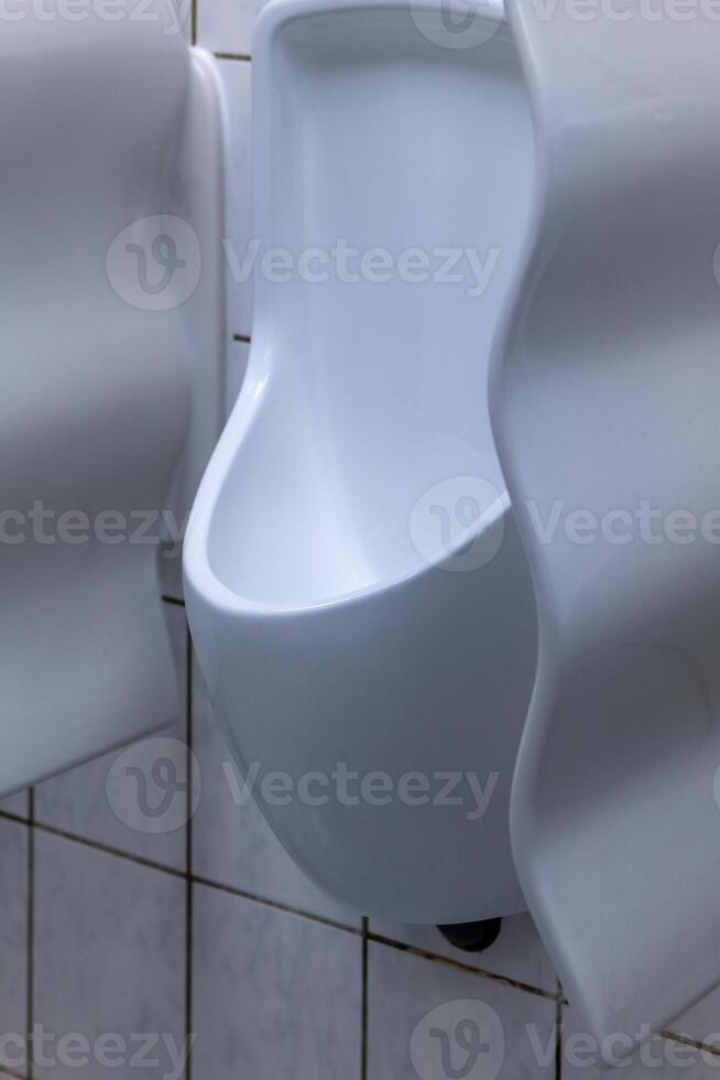 male urinal from a public toilet photo