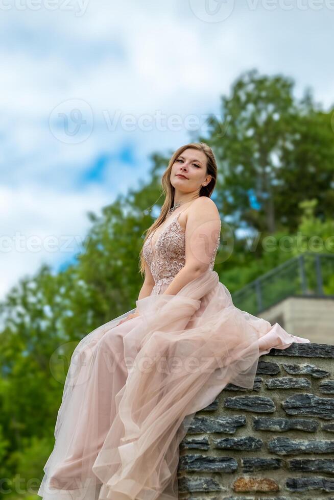 a pretty young woman in a cream coloured dress photo