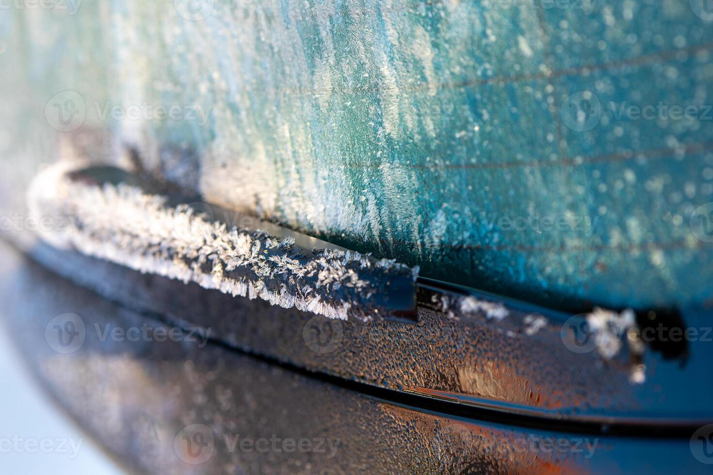 frozen rear window wiper from a car photo
