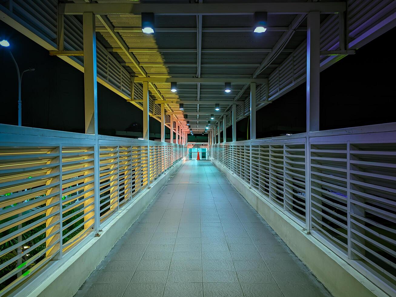 tunnel leading to the hospital with few lights photo