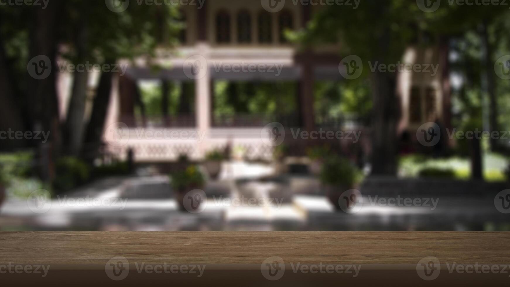Blank wooden table with blurred background. Good for product arrangement photo