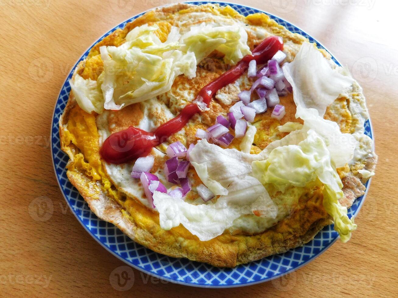 Indian Spiced Masala Omelet filled with fresh vegetable, healthy meal photo