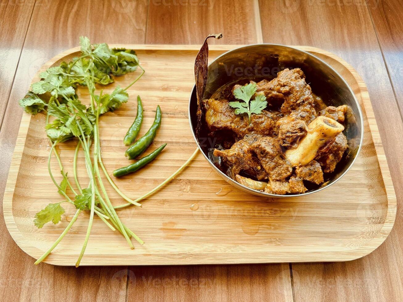Traditional Homemade Healthy Mutton Curry and Mutton Kosha, non-vegetarian food concept, Side View . Vancouver, British Columbia, Canada - January 14, 2024 photo