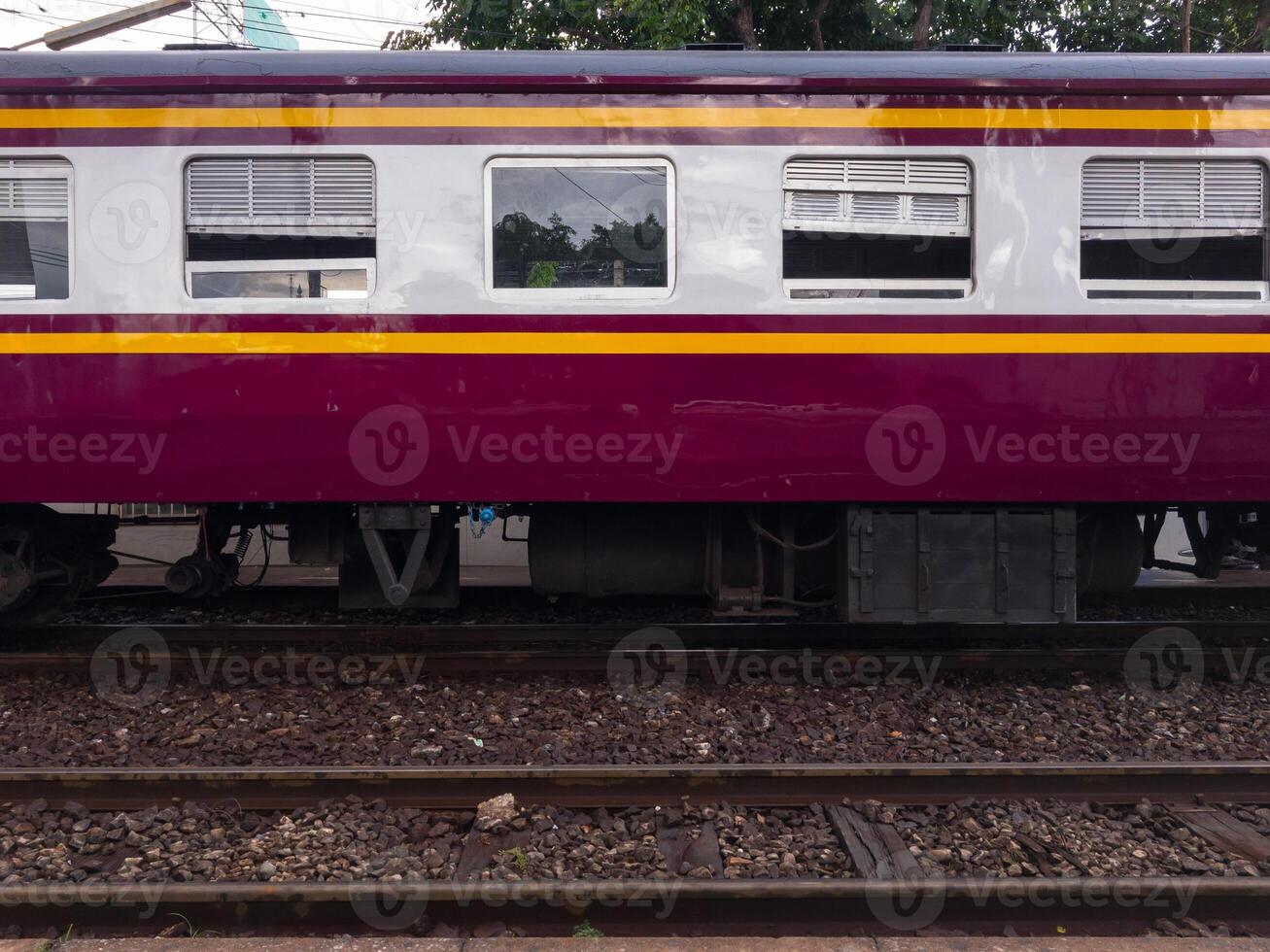 The side view of the bogie third class carriage of the ordinary train. photo