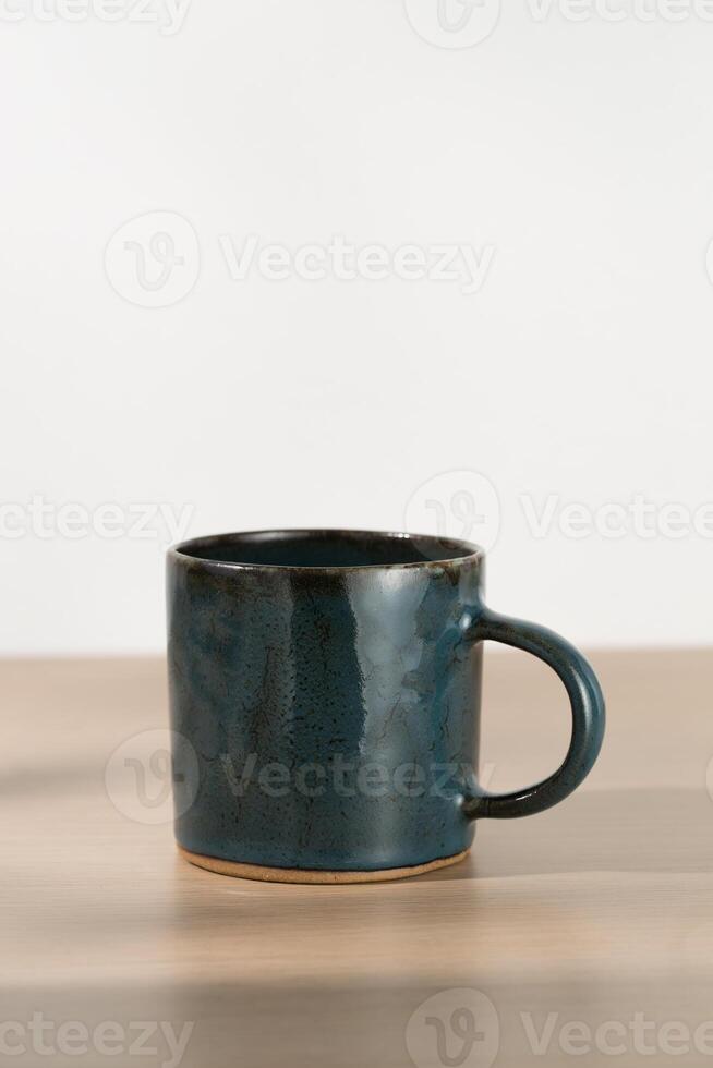 A dark blue ceramic mug photo