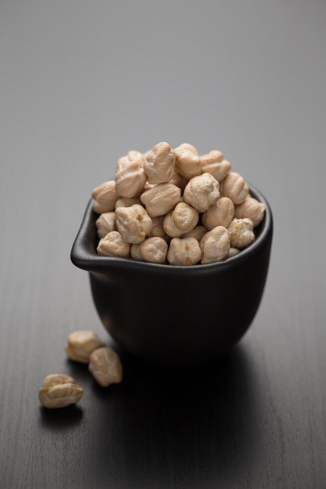 Chickpeas in a small black mug photo