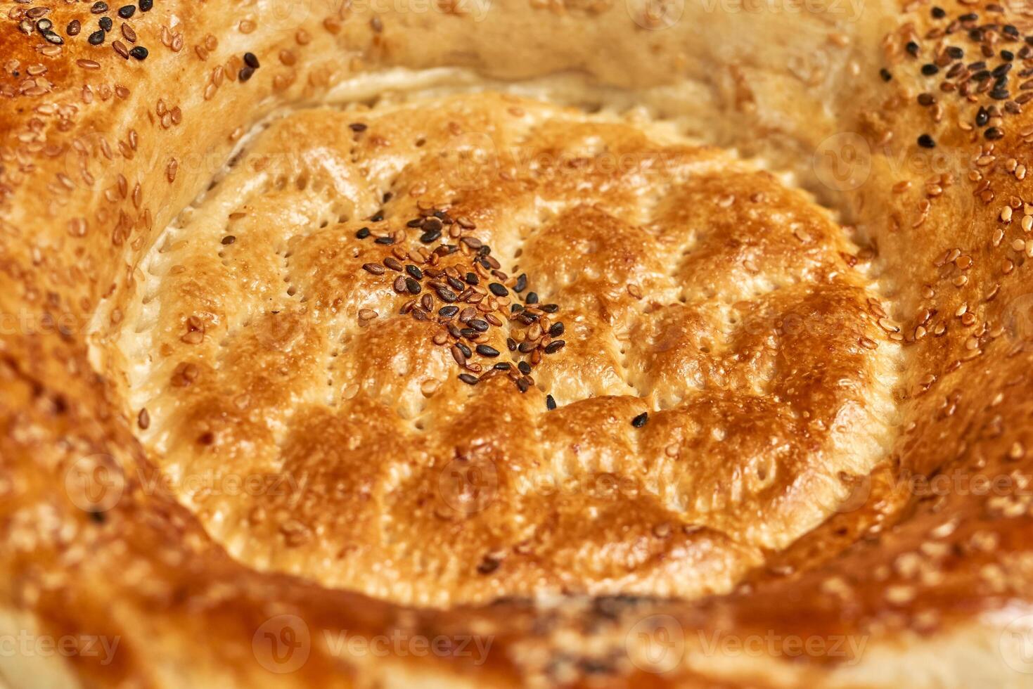 a close up of a pie with sesame seeds photo