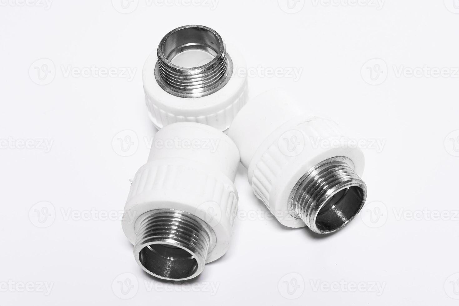 plastic pipe pieces on a white surface photo